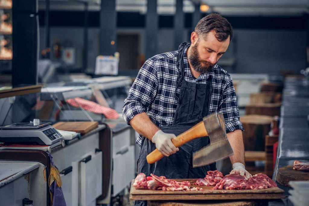 bearded butcher cuts meat with axe 2021 08 29 21 25 19 utc 1024x683